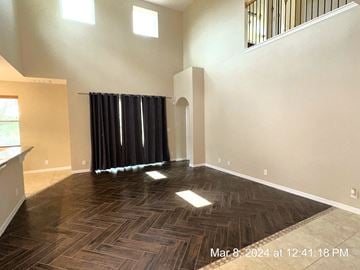 Clermont house for rent - a living room with hardwood flooring and a window and a curtain