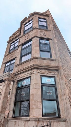 Chicago apartment for rent - the top of a tall building with many windows