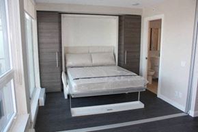 Surrey apartment for rent - a bedroom with a bed in a closet