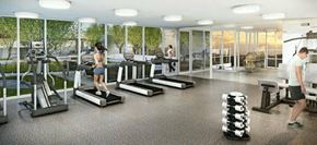 Surrey apartment for rent - a man and a woman in a gym with weights