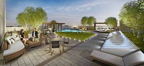 Surrey apartment for rent - a group of people sitting around a swimming pool
