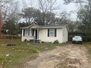 Mobile house for rent - a small house with a white truck parked outside of it