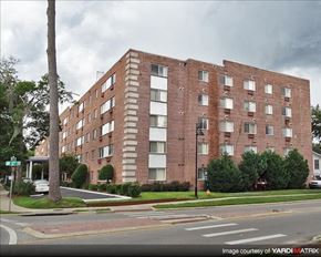 Gainesville apartment for rent - a brick apartment building on the corner of a street