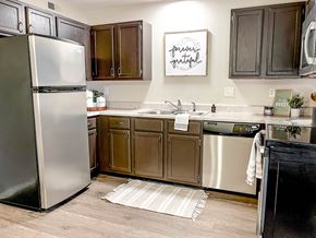 Arnold apartment for rent - a kitchen with stainless steel appliances and wooden cabinets