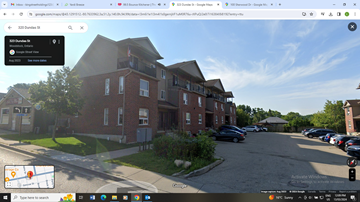 Woodstock apartment for rent - a screenshot of an apartment building with a parking lot