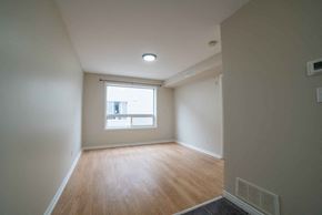 Kitchener apartment for rent - A room with a window and wooden flooring.