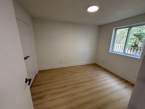 Kitchener apartment for rent - A room with a wooden floor and a window.