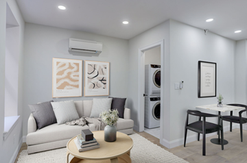 Boston apartment for rent - a living room with a couch and a table and a washing machine