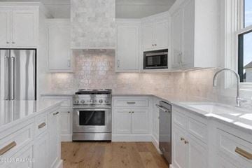 Lafayette apartment for rent - a white kitchen with a stove and a sink
