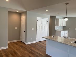 Hopkinsville house for rent - a kitchen with white cabinets and a counter top