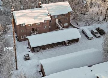 Anchorage apartment for rent - an aerial view of a building in the snow