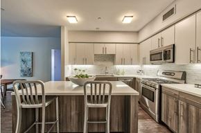 Los Angeles apartment for rent - a kitchen with a large island with two chairs