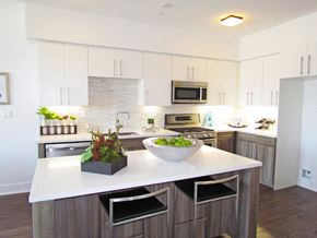Los Angeles apartment for rent - a large kitchen with a white counter top and a sink