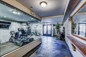 Sherman Oaks apartment for rent - a dentist office with a mirror and a chair in the window