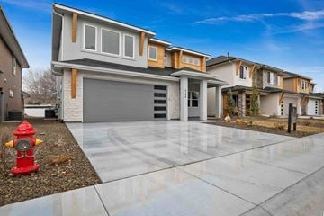 Boise house for rent - a house with a driveway and a fire hydrant in front of it