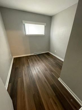 Lima apartment for rent - A room with wooden flooring and a window.