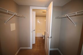 Edmonton house for rent - a walk in closet in a bathroom with a toilet