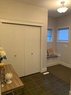 Edmonton house for rent - a room with a closet and a window and a table