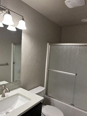 Bend apartment for rent - A bathroom with a sink, mirror, and shower.