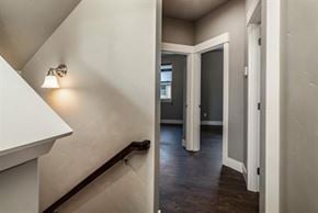 Bend apartment for rent - A hallway with a white wall and a light on.