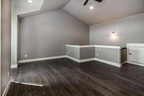Bend apartment for rent - A room with a ceiling fan and wooden flooring.