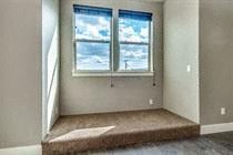 Bend apartment for rent - A room with a window and a carpeted floor.