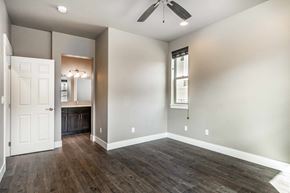 Bend apartment for rent - A room with a white door and a window with blinds.