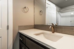 Bend apartment for rent - A bathroom with a white sink and a mirror.