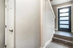 Bend apartment for rent - A white door is on the left and a black door is on the right.