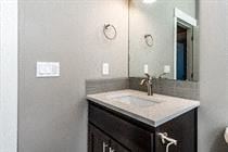 Bend apartment for rent - A bathroom with a sink and mirror.