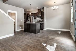 Bend apartment for rent - A kitchen with a bar area in the middle of the room.