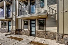 Bend apartment for rent - the front entrance of a building with a patio and a door
