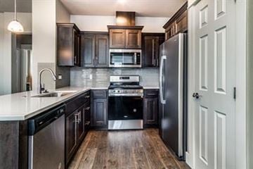 Bend apartment for rent - A modern kitchen with dark wood cabinets and stainless steel appliances.