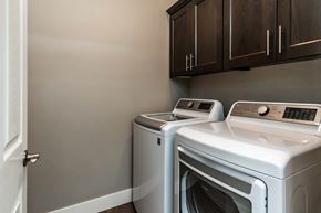 Bend apartment for rent - Two front loading washing machines in a laundry room.