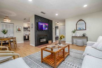 Gainesville apartment for rent - a living room with a fireplace and a television