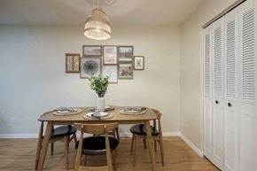 Gainesville apartment for rent - a dining room with a table and chairs next to a closet