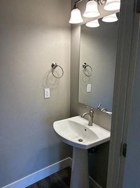 Bend apartment for rent - A bathroom with a sink and a mirror.