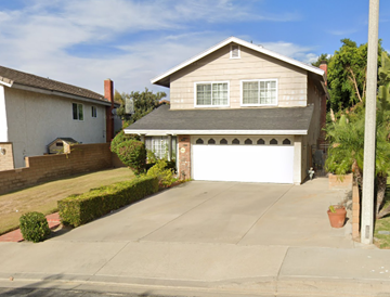 Walnut apartment for rent - a white garage door in front of a house