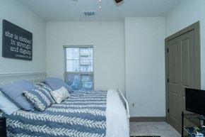 Clemson apartment for rent - a bedroom with a bed and a television in it