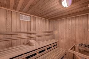 Santa Monica apartment for rent - A wooden sauna with benches and a light on the ceiling.