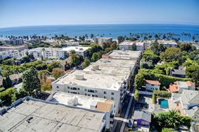 Santa Monica apartment for rent - A view of a city with buildings and a body of water in the distance.