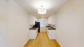 Sherman Oaks apartment for rent - a renovated kitchen with white cabinets and wood floors