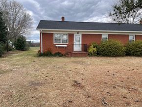 Lillington apartment for rent - a brick house with a yard in front of it