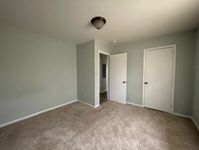 Lillington apartment for rent - a empty living room with gray walls and a carpet