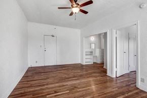Los Angeles apartment for rent - an empty living room with white walls and a ceiling fan