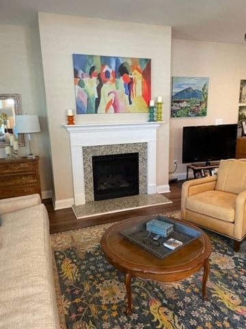 Denver house for rent - a living room with a fireplace and a coffee table