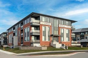 Ottawa apartment for rent - a rendering of a new apartment building on the corner of a street