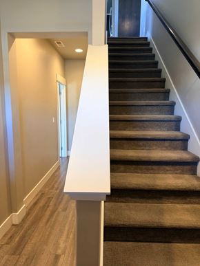 Bend apartment for rent - A staircase with a carpeted runner and wooden steps.