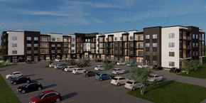 Plymouth apartment for rent - A parking lot with cars and a building in the background.