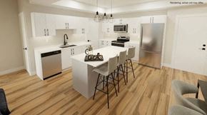 Plymouth apartment for rent - A modern kitchen with a dining table and chairs.